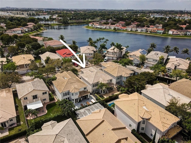 bird's eye view with a water view and a residential view