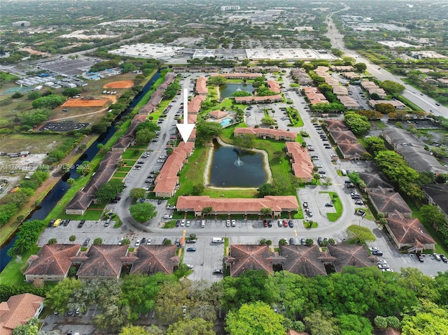 drone / aerial view featuring a water view