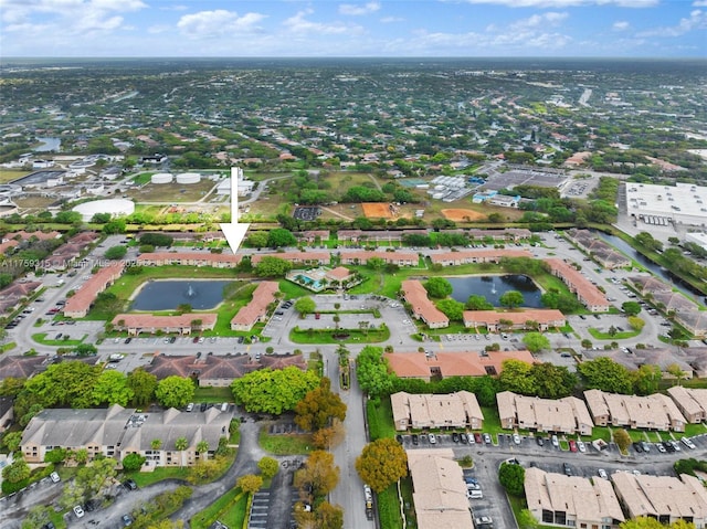 birds eye view of property featuring a water view and a residential view