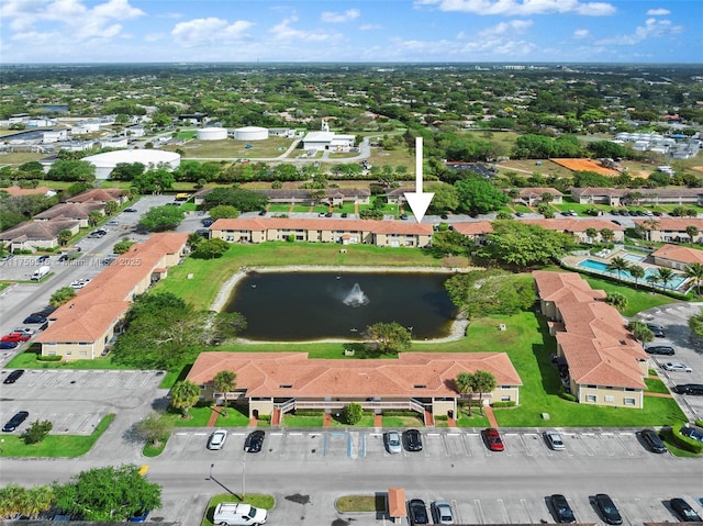 birds eye view of property with a residential view and a water view