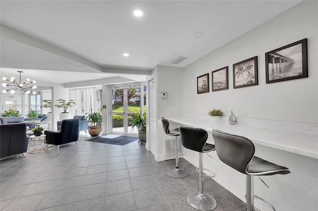 tiled dining room with a chandelier, visible vents, recessed lighting, and baseboards