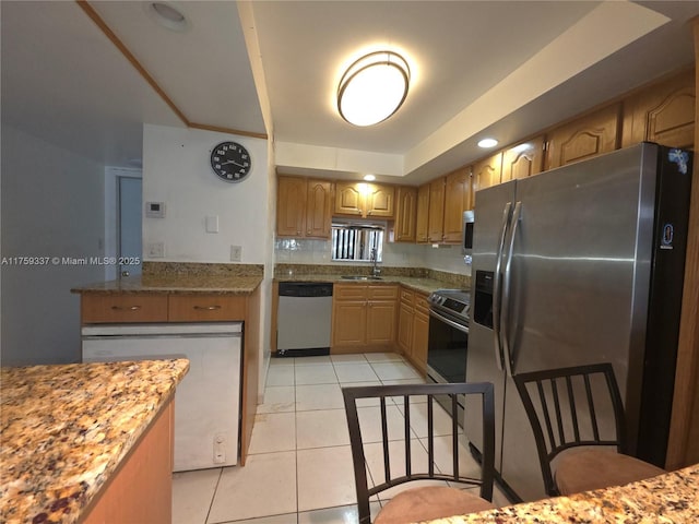8940 S Hollybrook Blvd Unit 109, Pembroke Pines, FL 33025 - kitchen with light tile patterned flooring, a raised ceiling, stainless steel appliances, and a sink