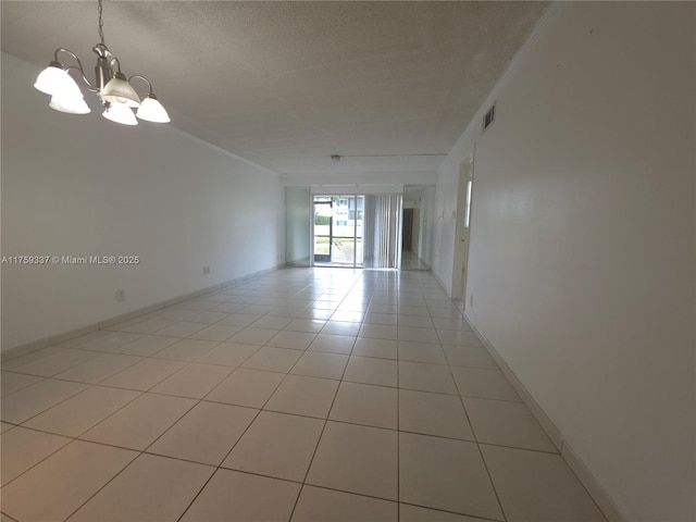 8940 S Hollybrook Blvd Unit 109, Pembroke Pines, FL 33025 - spare room with light tile patterned floors, an inviting chandelier, visible vents, and baseboards