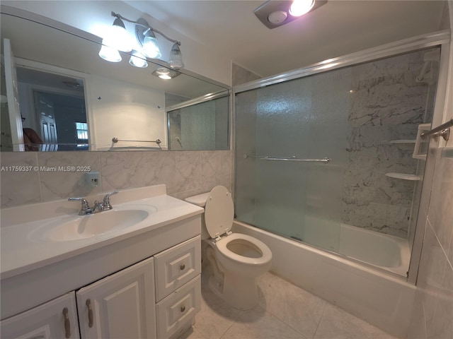 8940 S Hollybrook Blvd Unit 109, Pembroke Pines, FL 33025 - full bathroom with tile walls, vanity, decorative backsplash, bath / shower combo with glass door, and toilet