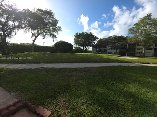 8940 S Hollybrook Blvd Unit 109, Pembroke Pines, FL 33025 - view of property's community with a yard