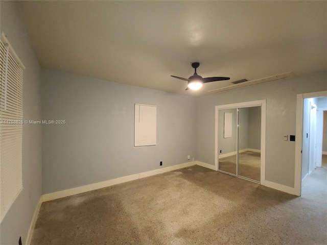 unfurnished bedroom featuring ceiling fan, a closet, visible vents, and baseboards