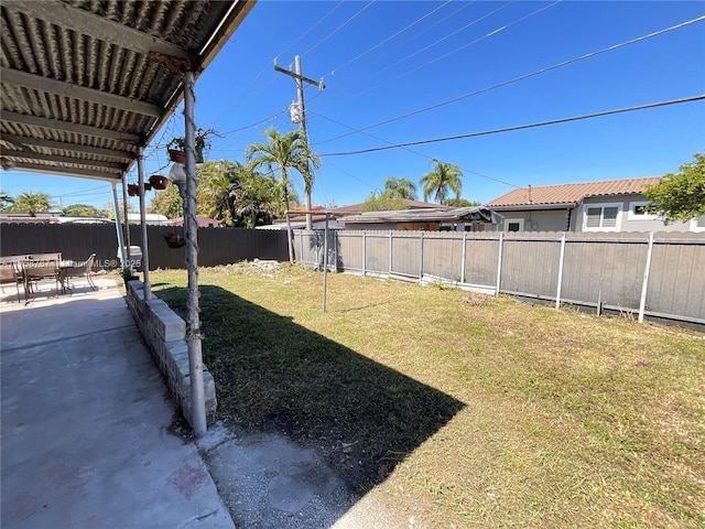 view of yard featuring a patio area and a fenced backyard