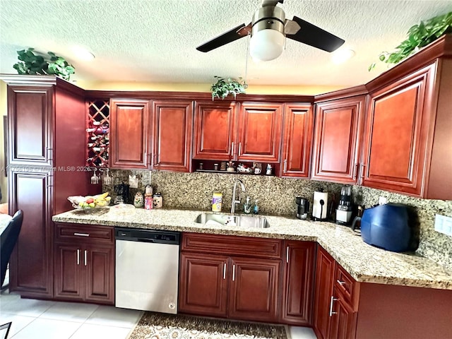 kitchen with dark brown cabinets, stainless steel dishwasher, a sink, and tasteful backsplash