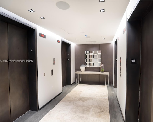 1451 Brickell Ave Unit 1201, Miami, FL 33131 - hall with elevator and light wood-style flooring