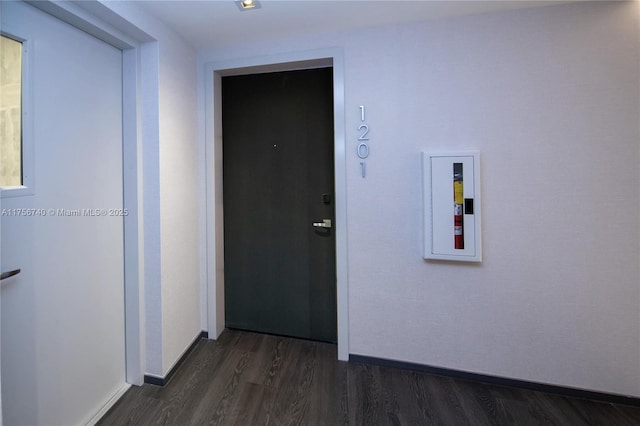 1451 Brickell Ave Unit 1201, Miami, FL 33131 - hallway featuring dark wood-type flooring and baseboards
