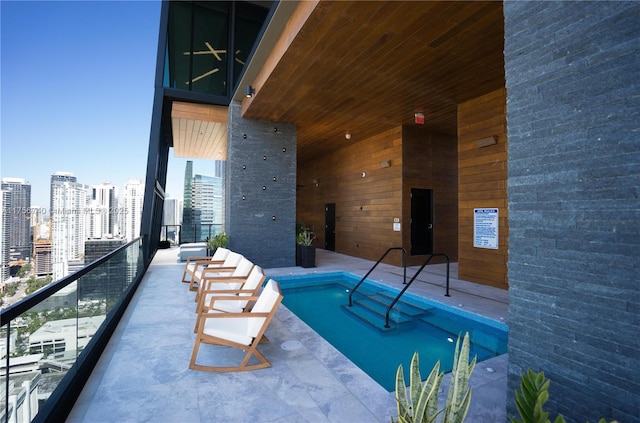 1451 Brickell Ave Unit 1201, Miami, FL 33131 - indoor community pool featuring a city view