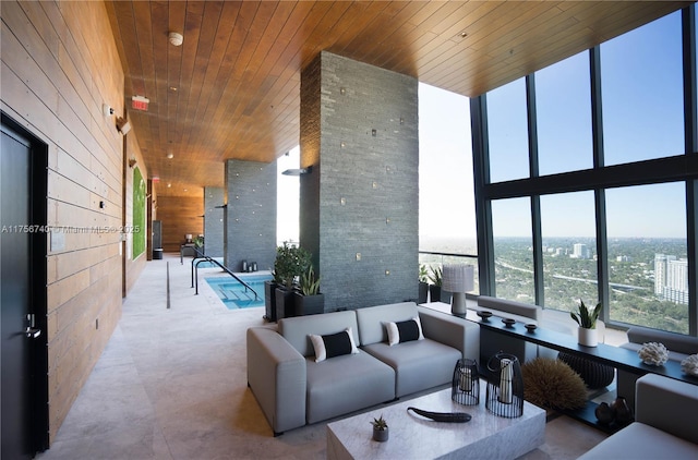 1451 Brickell Ave Unit 1201, Miami, FL 33131 - living room with wooden ceiling, wooden walls, a towering ceiling, and floor to ceiling windows