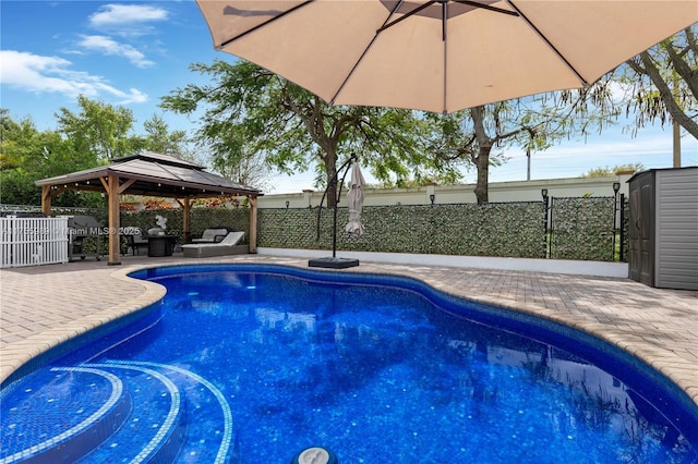 view of swimming pool featuring a gazebo, a fenced backyard, outdoor lounge area, and a patio area