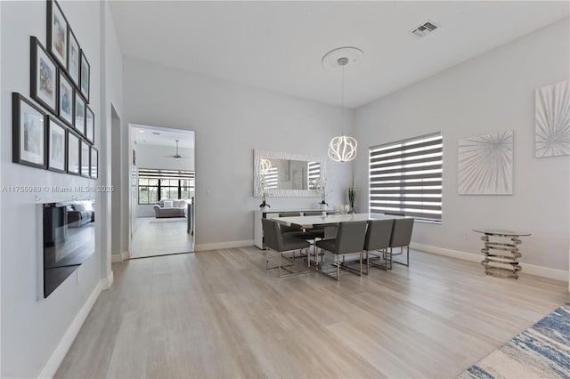 office space with visible vents, baseboards, and light wood-style floors