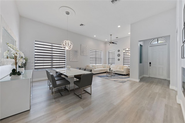 dining space featuring recessed lighting, light wood-style flooring, and baseboards