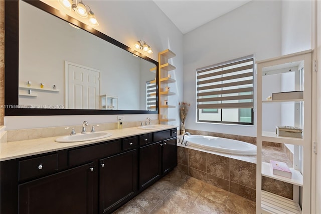 bathroom with a sink, a garden tub, and double vanity