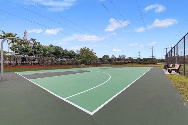 view of basketball court featuring community basketball court and fence