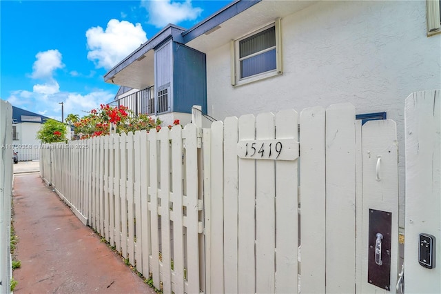 view of gate featuring fence