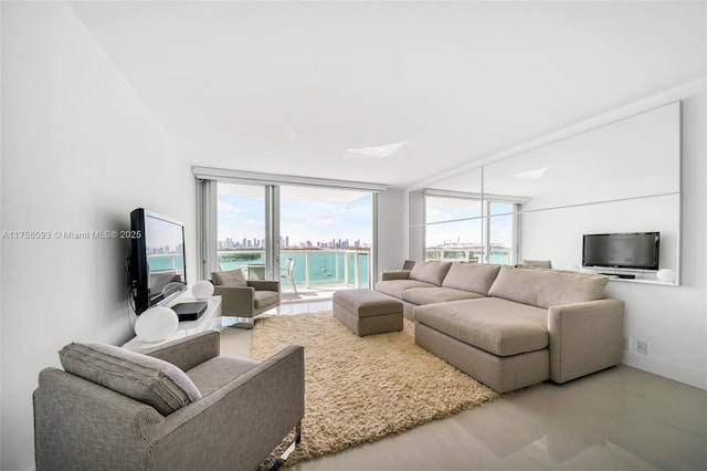 living area featuring baseboards