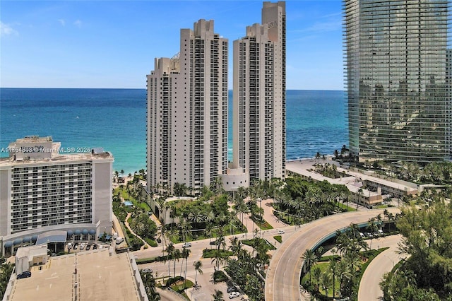 birds eye view of property featuring a water view and a city view