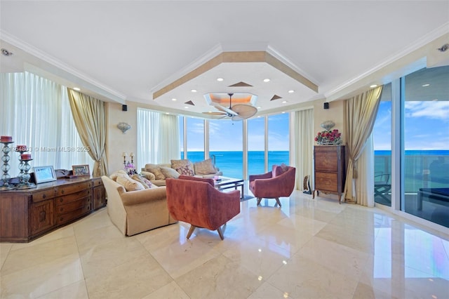 living area with a wall of windows, recessed lighting, a water view, and crown molding