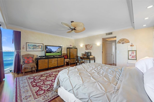 bedroom featuring ornamental molding, wood-type flooring, visible vents, and recessed lighting