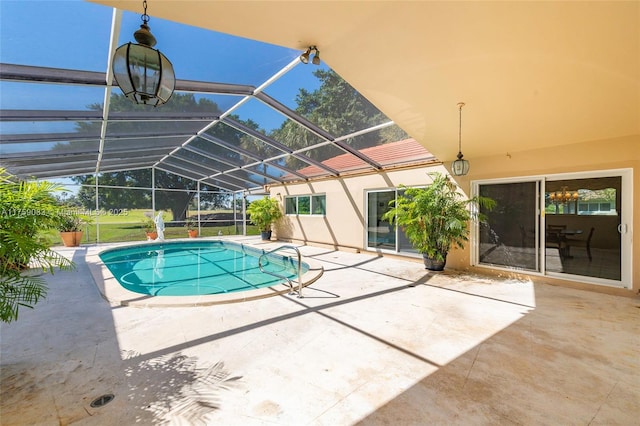 pool with glass enclosure and a patio