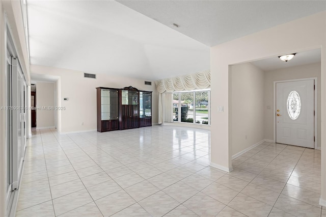 entrance foyer with baseboards, visible vents, and light tile patterned flooring