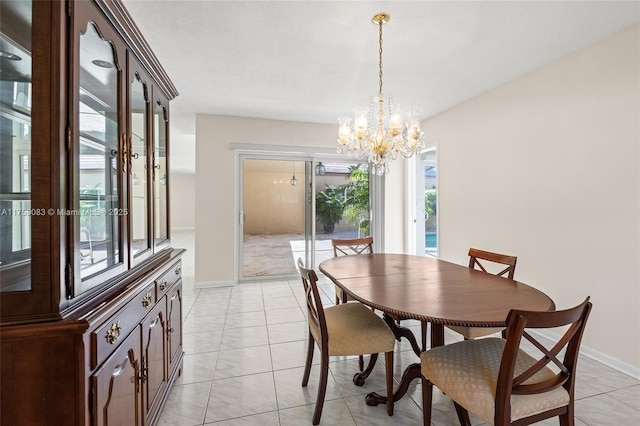 dining area featuring a chandelier, plenty of natural light, and baseboards