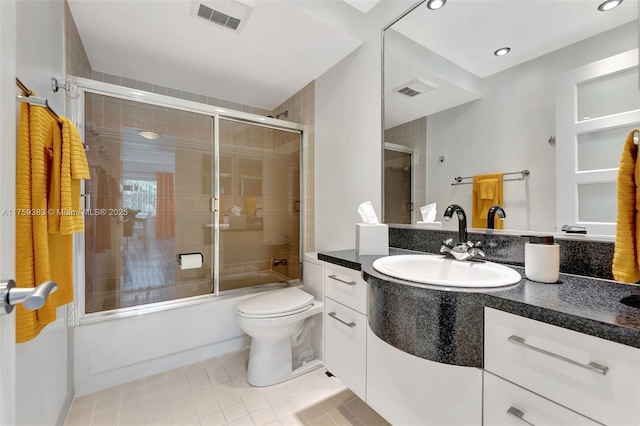 full bathroom with toilet, combined bath / shower with glass door, vanity, and visible vents