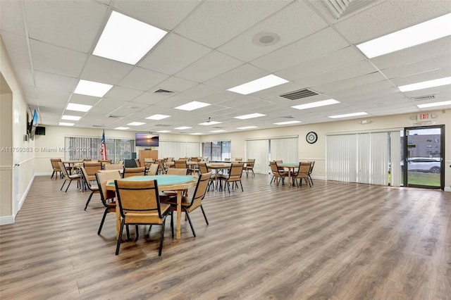 dining area featuring wood finished floors and visible vents