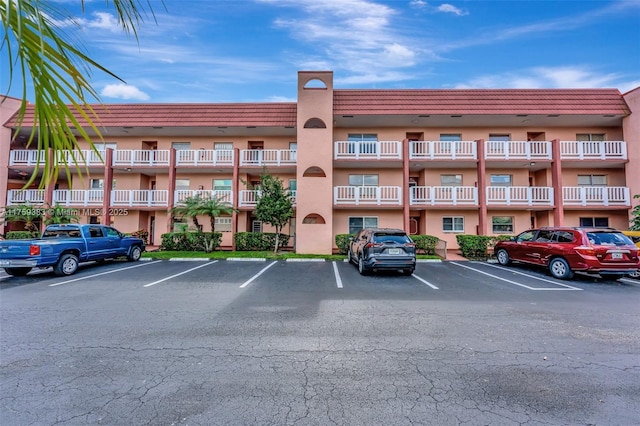 view of property featuring uncovered parking