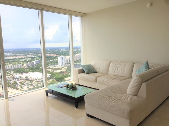 living room featuring a view of city, tile patterned floors, and floor to ceiling windows