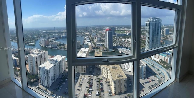 interior space featuring a water view and a city view