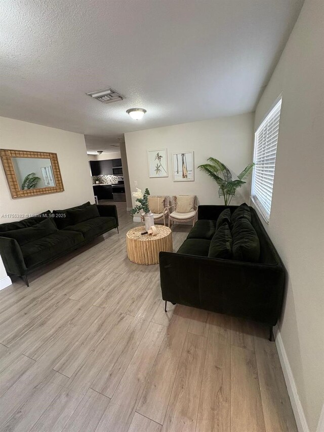 228 NW 12th St, Pompano Beach, FL 33060 - kitchen with dark cabinets, modern cabinets, light countertops, and appliances with stainless steel finishes