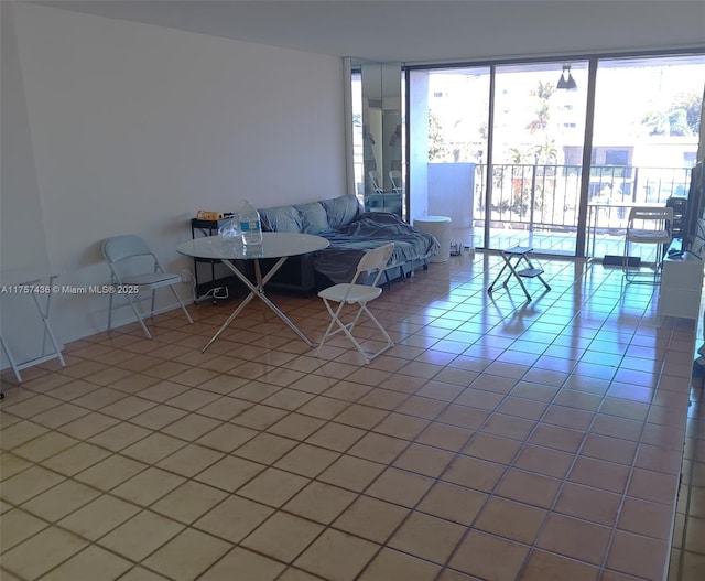 unfurnished living room with light tile patterned floors