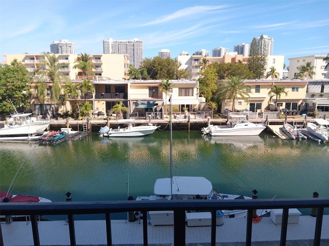 dock area featuring a view of city and a water view