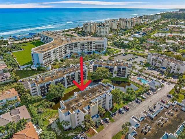 bird's eye view featuring a water view and a view of city