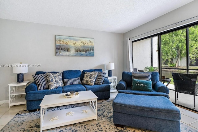 tiled living area featuring a textured ceiling and baseboards