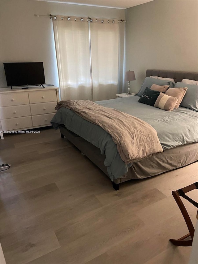 bedroom with wood finished floors