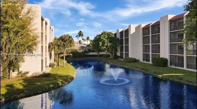 view of pool featuring a water view