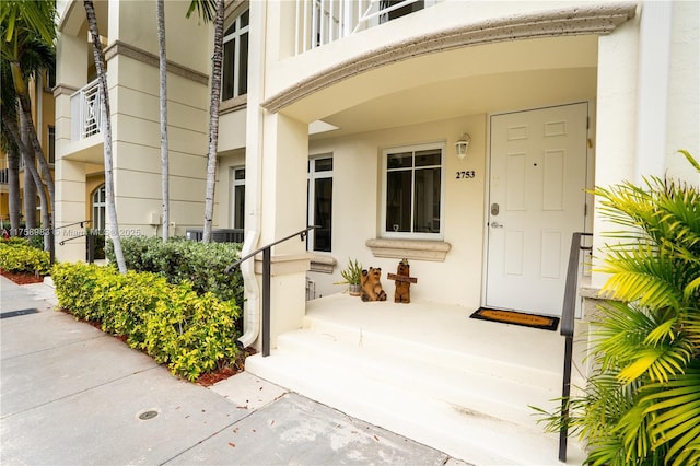 doorway to property with stucco siding