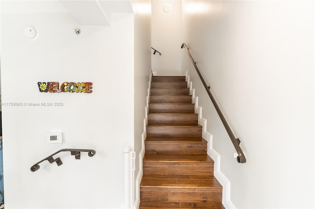 stairs with wood finished floors