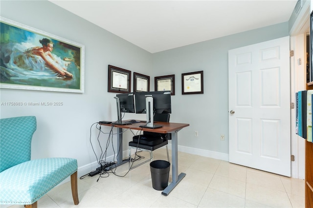 home office featuring baseboards and tile patterned floors