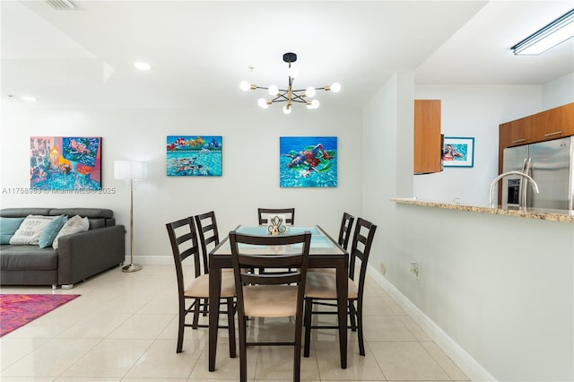 dining space with recessed lighting, light tile patterned flooring, a notable chandelier, and baseboards