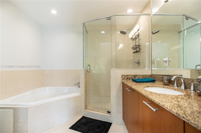 bathroom with recessed lighting, a stall shower, vanity, tile patterned flooring, and a bath