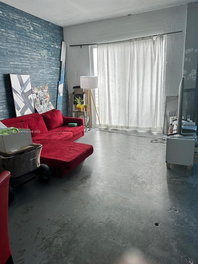 living room featuring concrete flooring