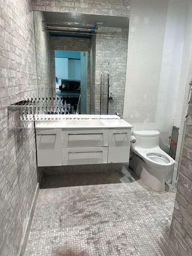 bathroom with vanity and toilet