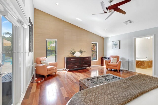 12200 SW 2nd St, Plantation, FL 33325 - bedroom with wood finished floors, access to outside, multiple windows, high vaulted ceiling, and recessed lighting
