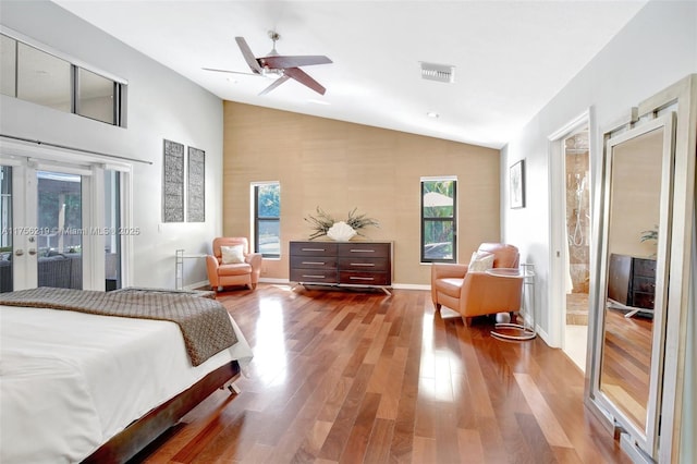 bedroom with lofted ceiling, access to outside, wood finished floors, french doors, and ceiling fan